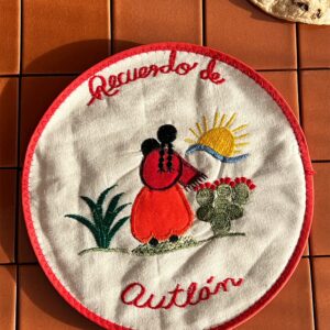 tortilla wamer with a hand sewn image of a women facing the sun. Souviner of Autlán